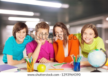School Children in the Classroom Writing / Royalty-Free Stock Photo #1293964390