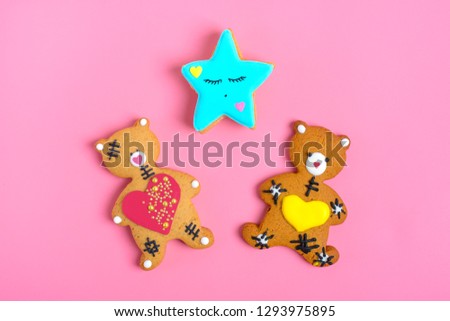 Romantic Teddy bear gingerbread with heart  and star on trendy pink background. Happy Valentine's Day, Mother's Day, March 8, World Women's Day holiday card concept. Flat lay. Top view. Copy  space. 