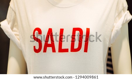 Italian shopping sale banner, special offer, saldi - white t-shirt with red saldi print (inscription). 