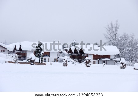 Winter ski chalet and cabin in snow mountain landscape in Austria, Europe.