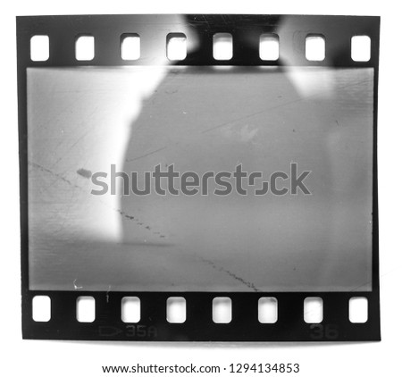 35mm film frame or strip on white, 135 film material, macro photo no scan
