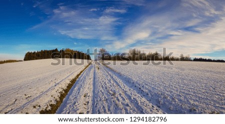 beautiful snowy winter panorama view of frozen natural landscape under a cold cloudy sky with snow and ice