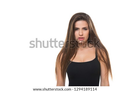 Close-up portrait of a young Positive girl who having fun and makes grimaces isolated on white background.