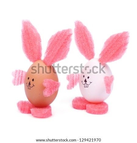 Two beautiful Easter bunny isolated on white background. Toy of the egg shell. postcard