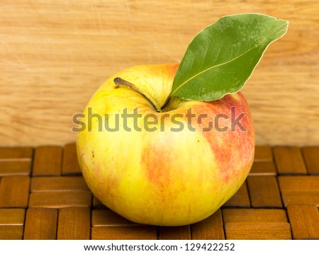 ripe apple on a wooden background