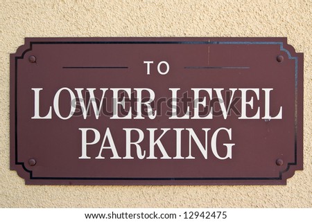 Downtown parking sign on stucco wall