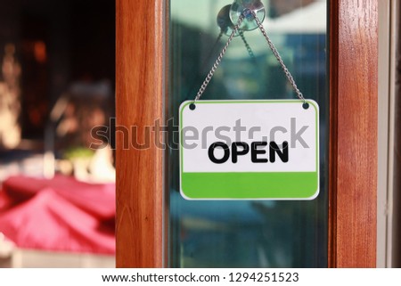 open sign hanging at door for entrance