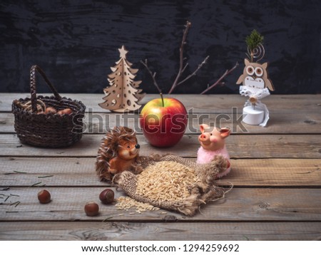 Fairy-tale picture about two toy characters of a hedgehog and a pig, who grazed the grain harvest.