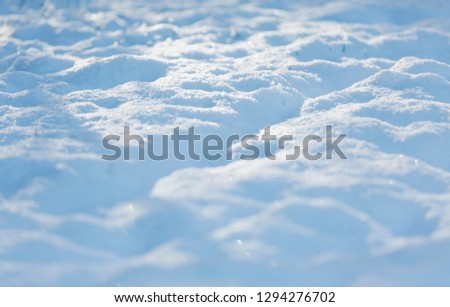 Closeup of sunlight hitting snow covered ground