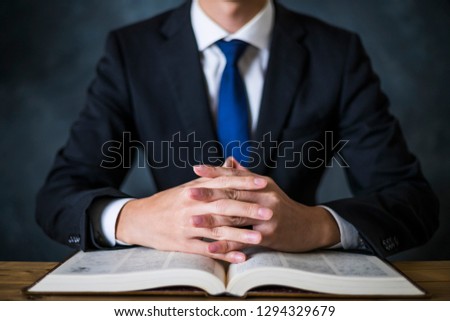 businessman reading a heavy book