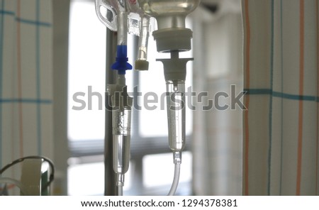 Close up saline solution drip for patient in hospital. 