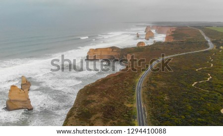 The Twelve Apostles on a cloudy afternoon, panoramic aerial view from Gibson Steps parking, Australia.