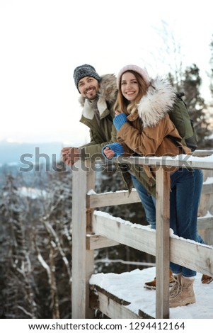 Couple spending winter vacation together in mountains