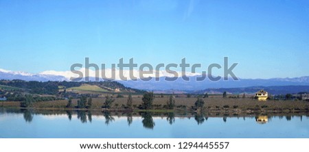 Snowy mountains and the reflection of the river looks very nice. Adana /Turkey