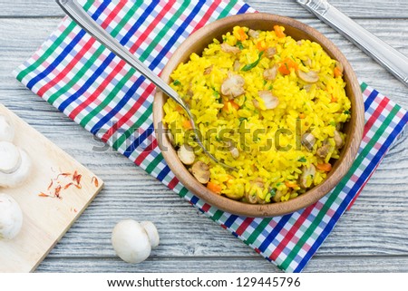 Vegetarian dinner - rice with saffron and mushrooms