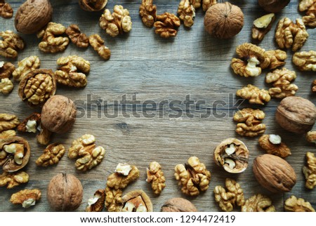 Close-up view of delicious cracked walnut on wooden table