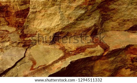 very close view of stone like big hills system in a planet 
hill like stand very beautiful locations deep colors of hills and stone