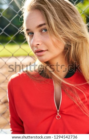 Gorgeous blond athlete in red, portrait