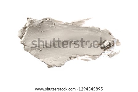 Cosmetic face cream, clay smeared and isolated on white background