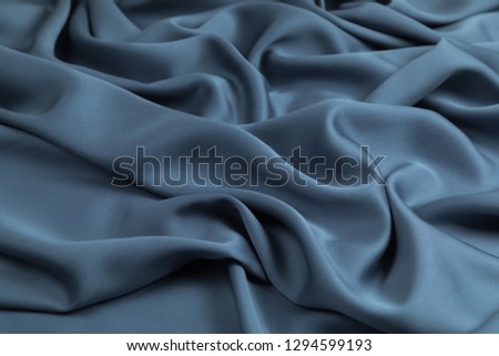  Blue Fabric for a decor and an interior is put  by decorative spiral folds