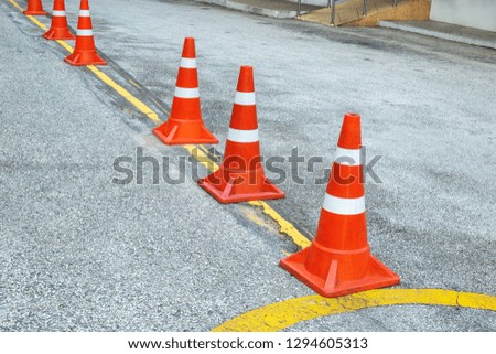 Plastic Traffic Cones Signaling to Encloses in the Car Parking Area.