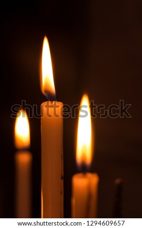 A picture of a set of candles burning inside the Ghent Belfry.