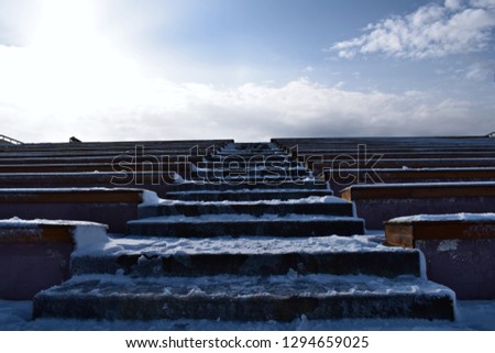 Staircase covered in snow.Winter, Sunny day.