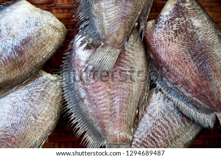 Tilapia alimentarium is a warm freshwater fish, but some species adapt very well to living in the sea. Here on the market in Ban Phe for sale 