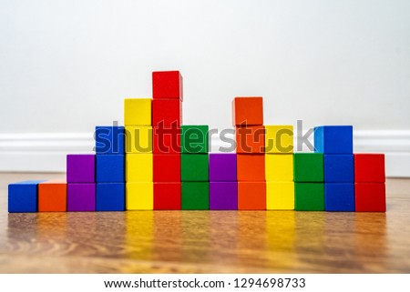 Colorful stack of wood cube building blocks 