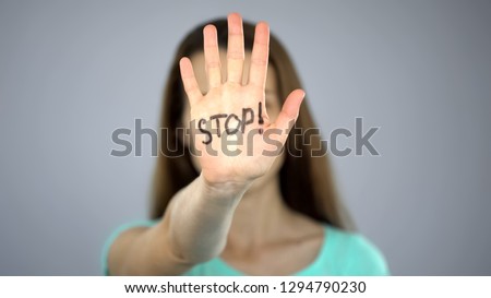 Stop sign on womans hands, female rights protection, awareness of problem Royalty-Free Stock Photo #1294790230