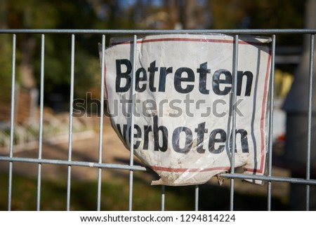 Sign on a fence with the inscription "do not enter"                               