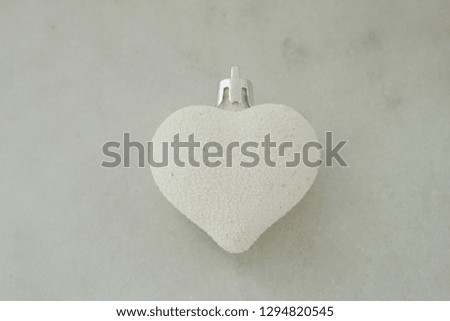 White heart on white background