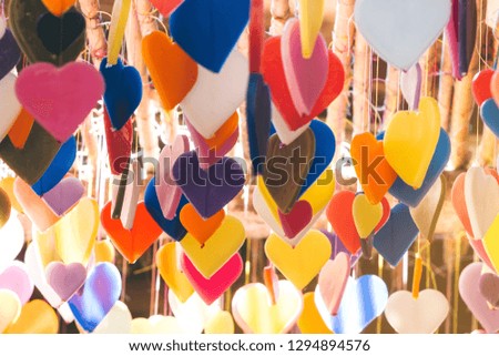 Colorful of hearts made of candle pattern designs hanging from ceiling to decorated on Love Valentines celebration day or wedding day.