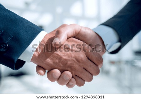 Close-up of business people handshaking