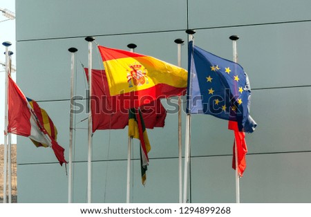 Flag of Spain next to the European Union