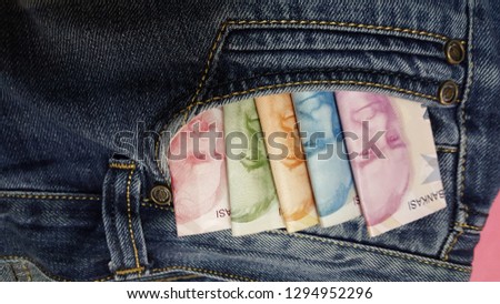 Turkish lira on denim fabric