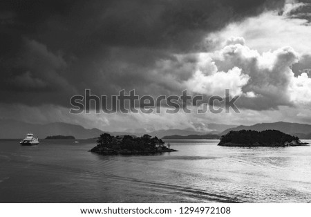 View into the cloudy and rainy fjord from Halhjem