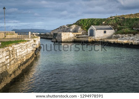 This is the picture of Ballintoy harbor on the Antrim Coast in Northern Ireland.  This it the film location for the Game of Thrones