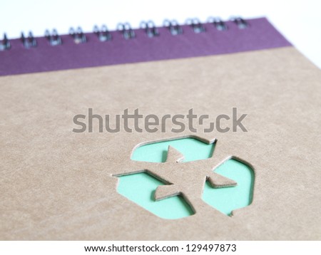 recycling symbol on cardboard book