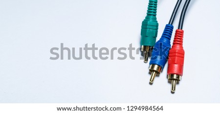 Multimedia multi-colored cables. Or tulips adapters for audiodevices. On a white background. The isolated object. 