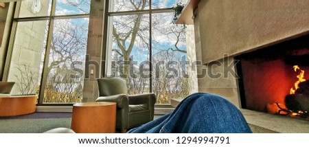 Relaxing by the Fire Royalty-Free Stock Photo #1294994791