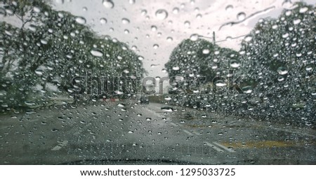 Autumn rain, sweaty glass. a drop of rain on the car window. Rain water drops on a glass surface background, Abstract Backdrop