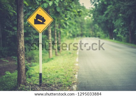 Traffic sign on road on hills