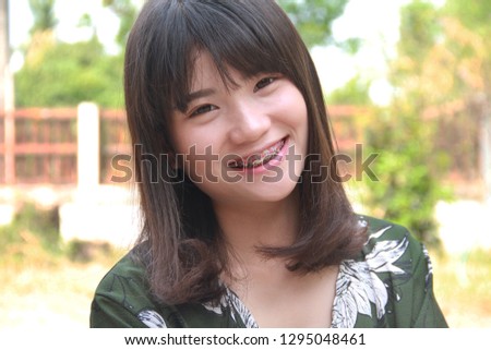 Asian woman happy smiling in outside 