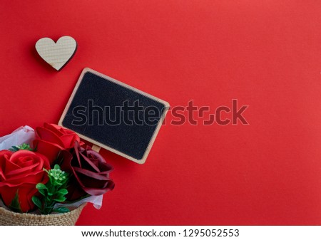 Valentines day background with red background and wooden hearts, Place for text, copy space.