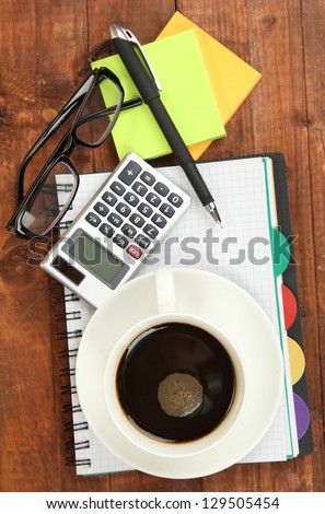 Cup of coffee on worktable close up