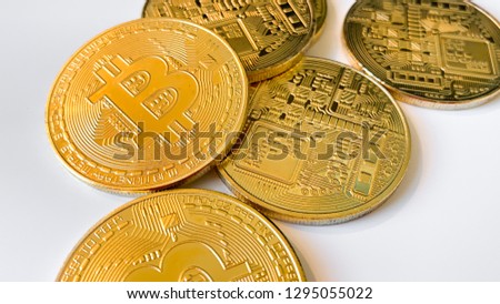 Golden bitcoins on the white background. Bitcoin is a convenient payment in a global economy market. Virtual digital currency and financial investment trade concept. Blockchain transfers concept.