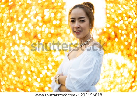 portrait asian beautiful women of smiling with blur bokeh light background and fashion shirt white or jeans