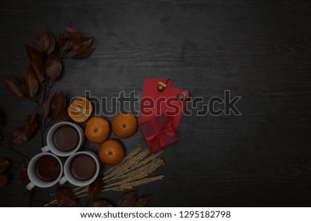 Top view aerial image shot of arrangement decoration Chinese new year & lunar new year holiday background concept.Flat lay fresh orange with food & drink
