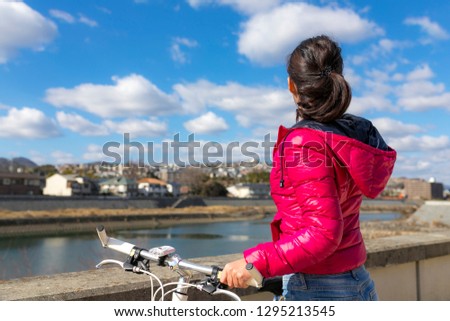 Asian female and cycling